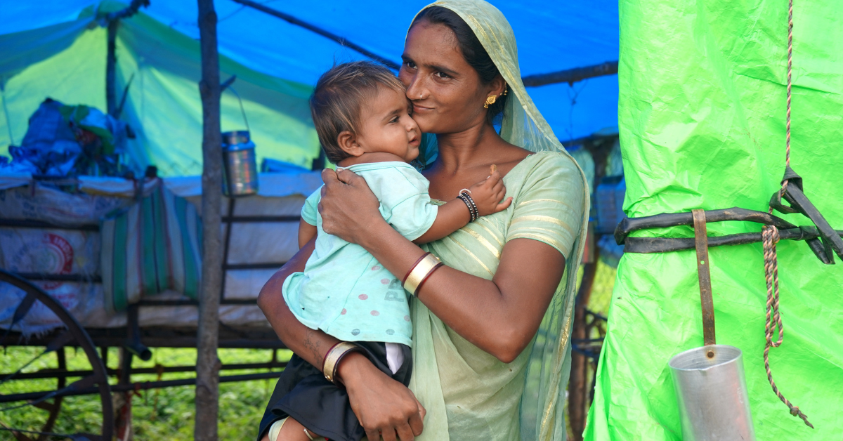 Christian woman from India holding a baby girl